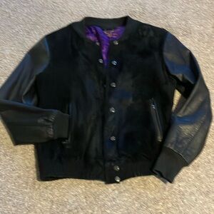 Real cow leather. Wore a few times. Size is too small.